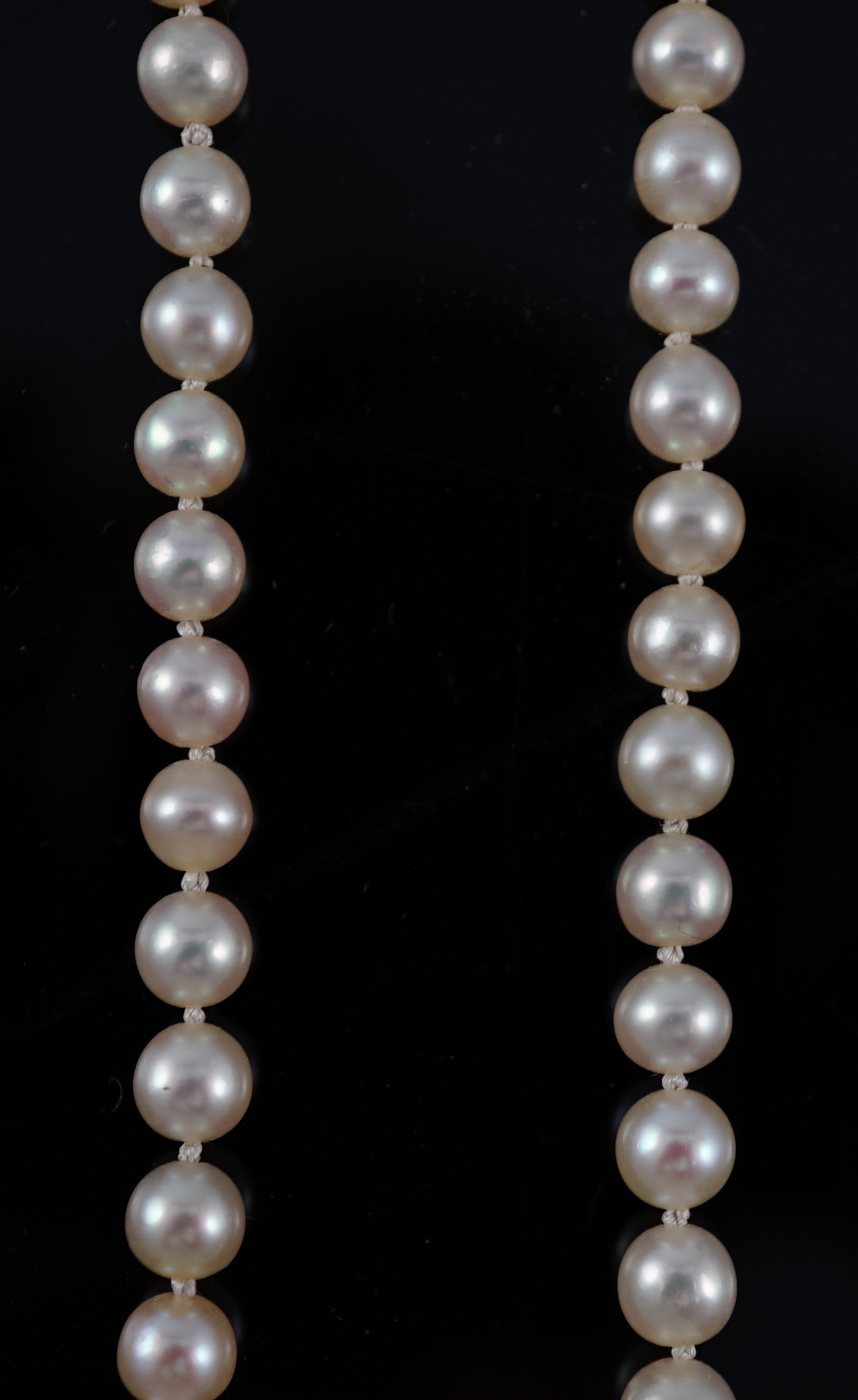 A late Victorian single strand graduated natural saltwater pearl necklace, with six stone old round cut diamond set silver and gold rectangular clasp